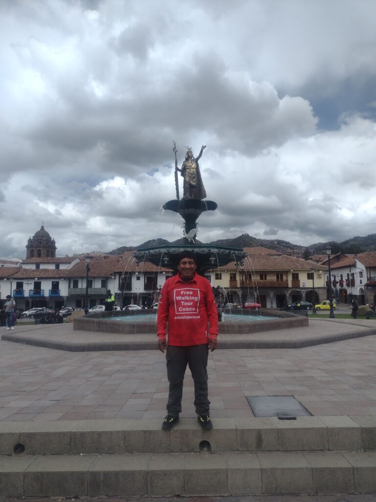 Free Walking Tour Cusco by Inca statue.